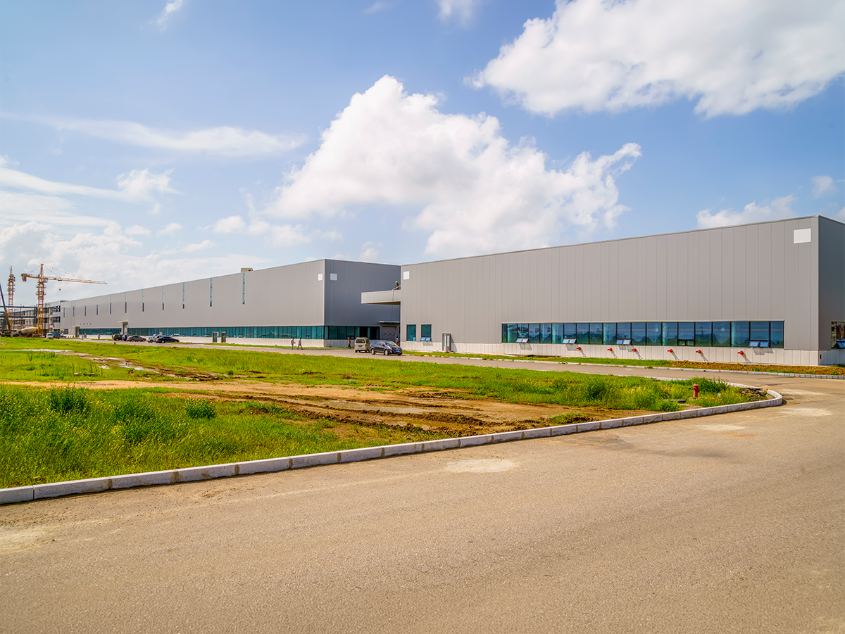 Industrial solar installation near a factory and manufacturing facility